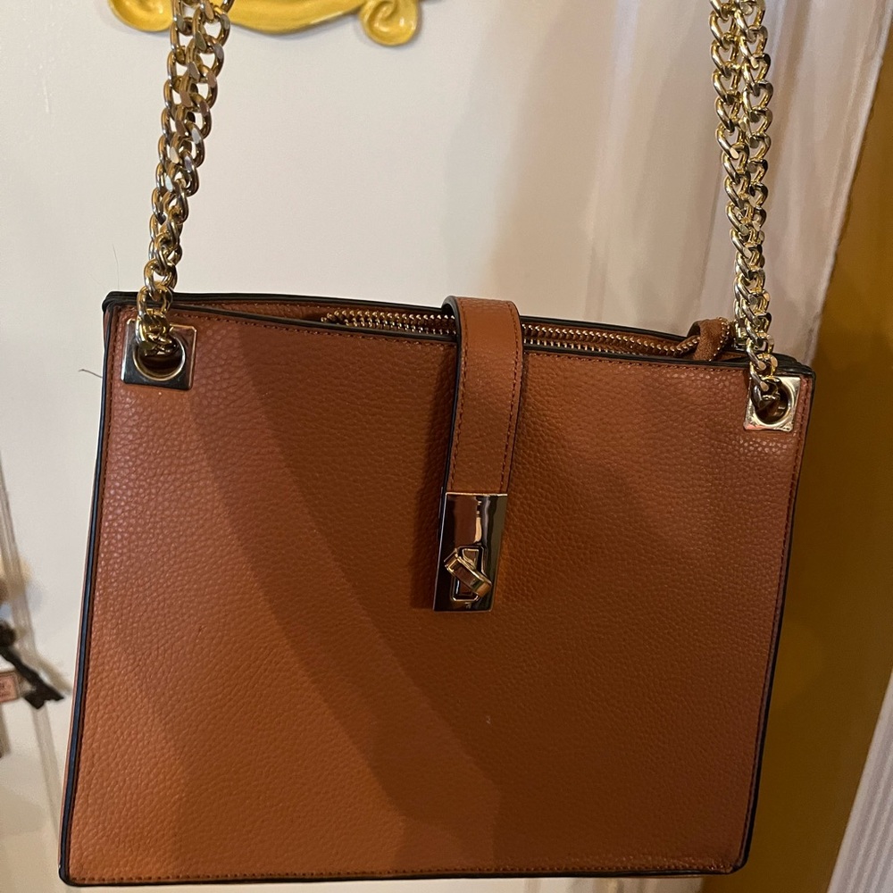 Handbag. Roomy inside. Beautiful detailing. Chain and leather handles.